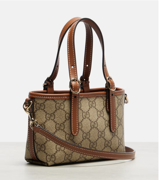 Designer handbag with brown and beige pattern on a white background