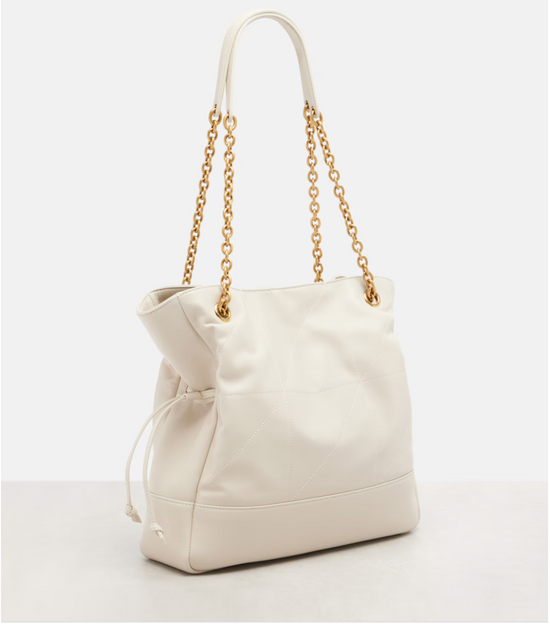 Beige handbag with gold chain strap on a white background