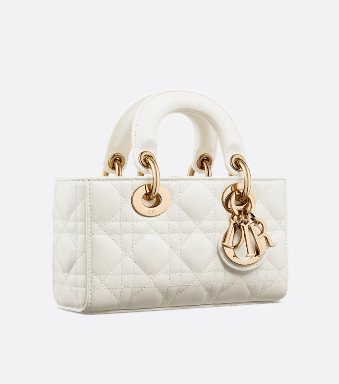 White quilted handbag with gold hardware on a white background