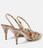 Beige high-heeled shoes with decorative patterns and embellishments on a light gray background