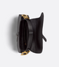 Black handbag with gold clasp on a white background