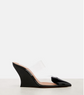 Black patent leather wedge sandal on a white background