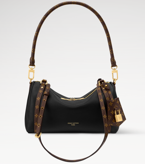 Louis Vuitton handbag with monogram pattern on a light gray background