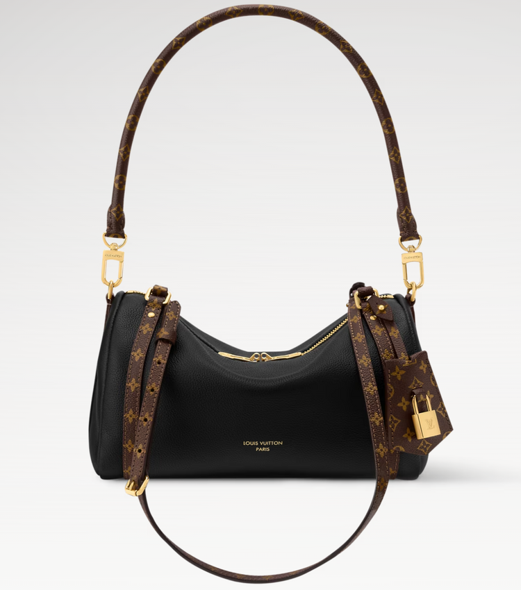 Louis Vuitton handbag with monogram pattern on a light gray background