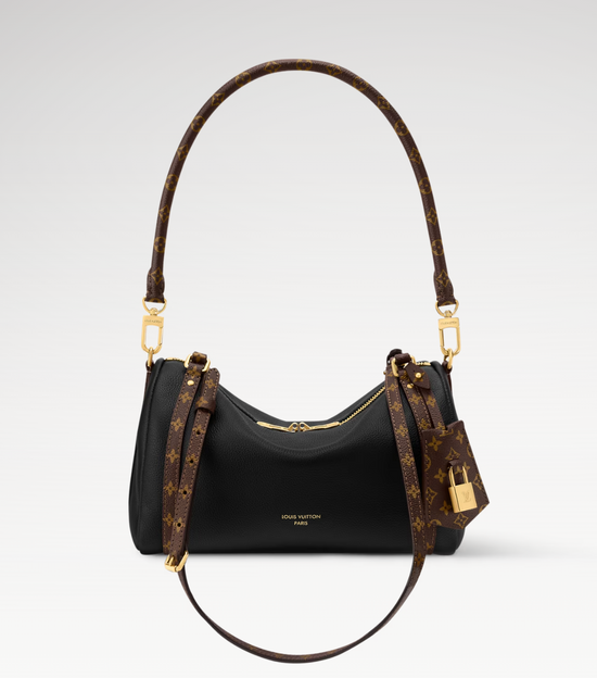 Louis Vuitton handbag with monogram pattern on a light gray background