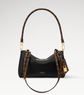 Louis Vuitton handbag with monogram pattern on a light gray background