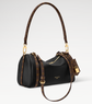 Black handbag with brown leather handle and strap on a white background