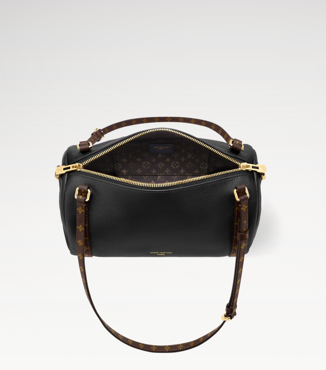 Black handbag with gold accents on a light gray background