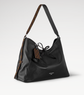 Black handbag with a patterned strap on a light gray background