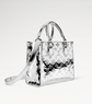 Silver handbag with monogram Louis Vuitton pattern on a white background