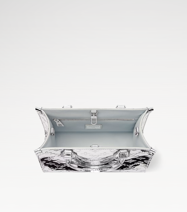Clear bag with metallic accents on a white background
