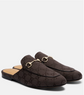 Brown patterned slippers with gold accents on a white background