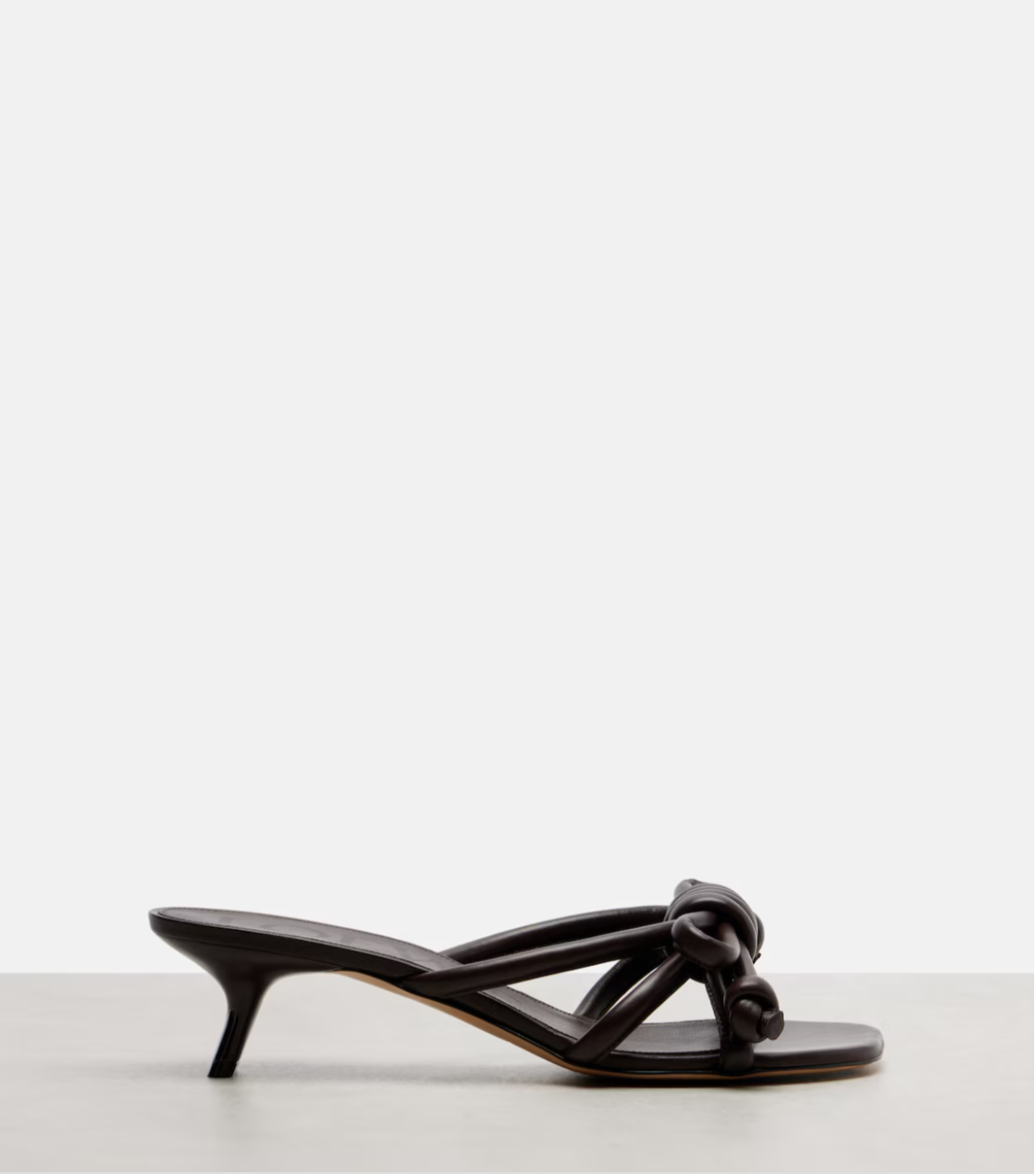 Brown sandal with a bow on a white background
