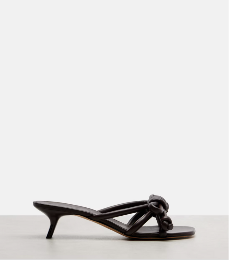 Brown sandal with a bow on a white background
