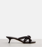 Brown sandal with a bow on a white background