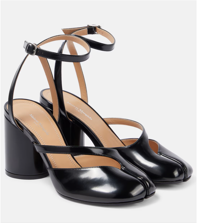 Black high-heeled shoes with open-toe design on a white background