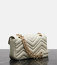 Gucci White quilted handbag with a gold chain on a reflective surface with a light gray background