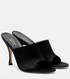 Black high-heeled mules with Gucci logo on a white background