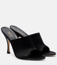 Black high-heeled mules with Gucci logo on a white background