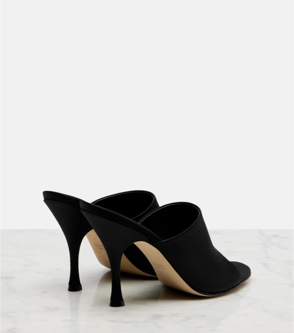 Black high-heeled shoes on a white background