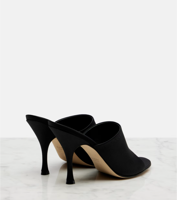 Black high-heeled shoes on a white background