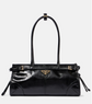 Black handbag with a brand logo on a white background