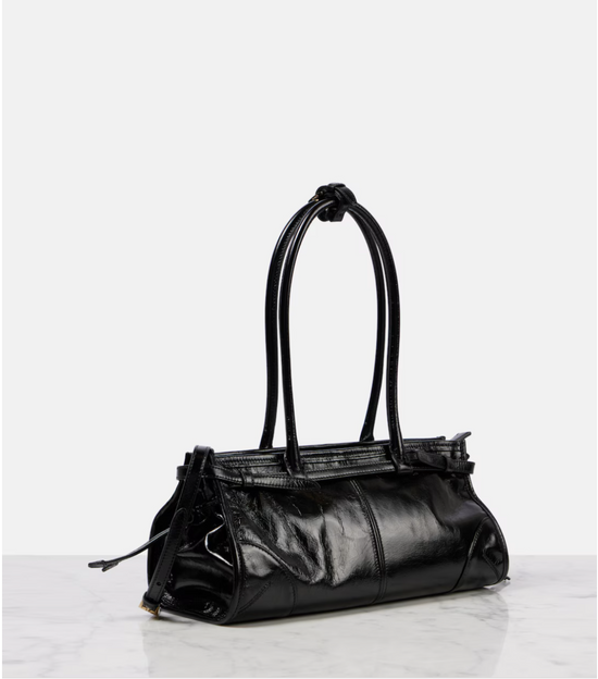 Black leather handbag on a white background