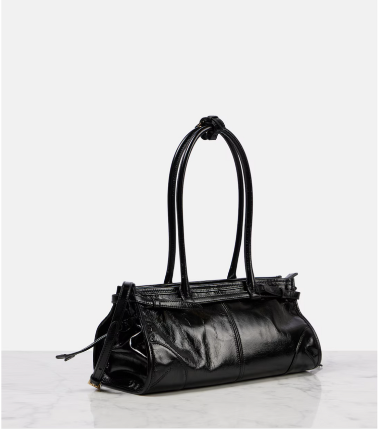 Black leather handbag on a white background