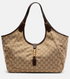 Beige gucci handbag with brown accents on a light gray background