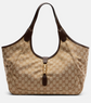 Beige gucci handbag with brown accents on a light gray background