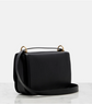 Black handbag with gold hardware on a white background