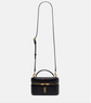 Black quilted YSL handbag with gold accents on a white background