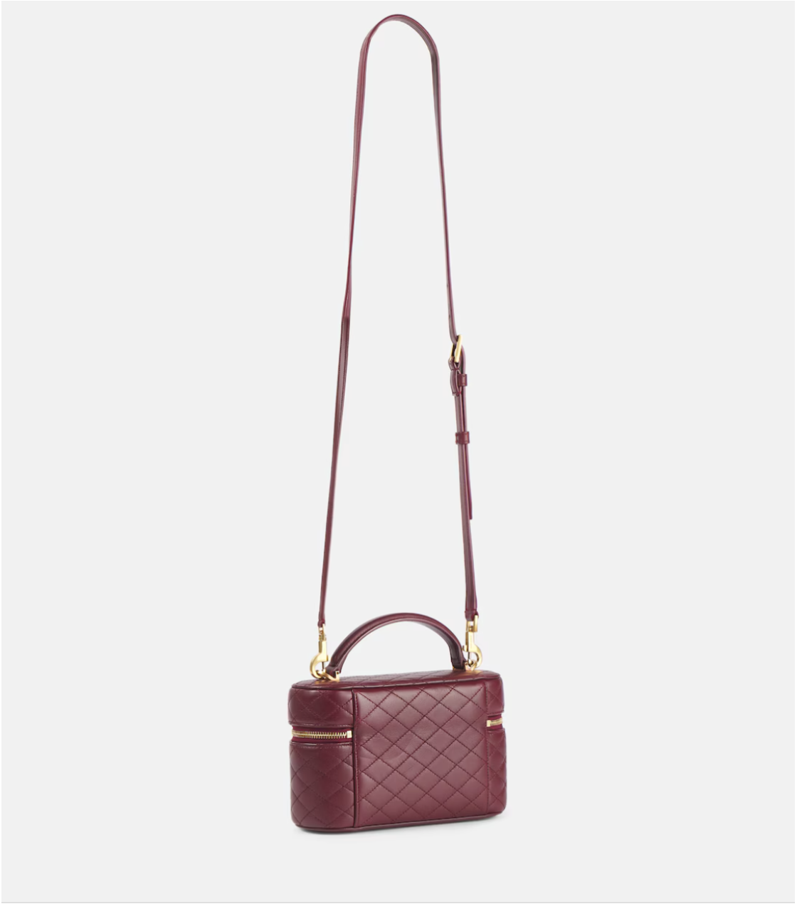 Maroon quilted handbag with a strap on a light gray background
