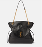 Black handbag with gold chain strap and YSL logo on a white background