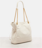 Beige handbag with gold chain strap on a white background
