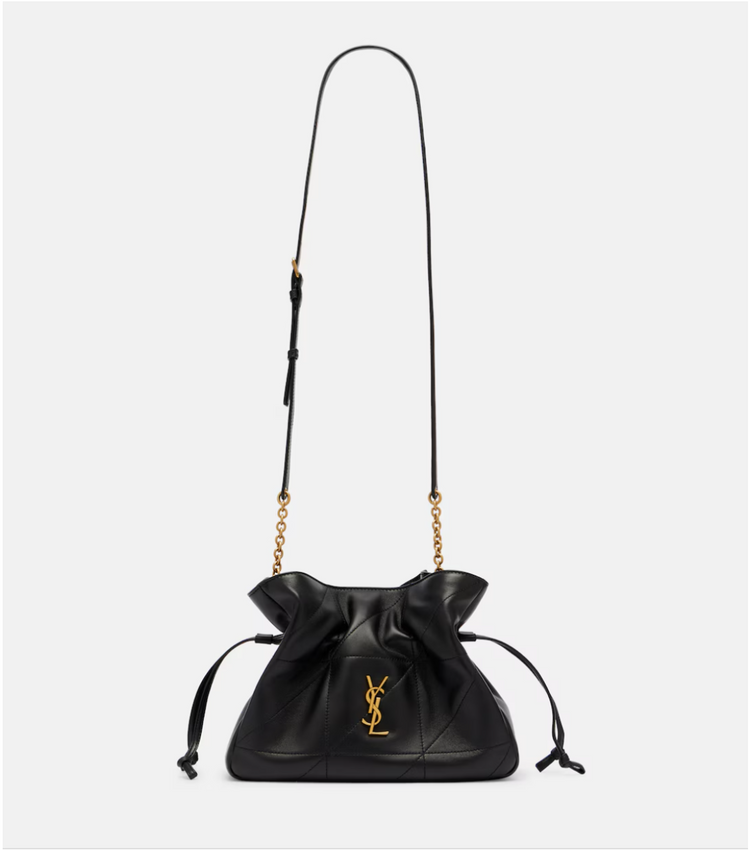 Black leather YSL handbag with a drawstring and gold chain strap on a white background