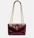 Burgundy handbag with gold chain strap on a white background