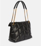 Black quilted handbag with gold chain strap on a white background