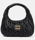 Black quilted handbag with &