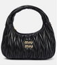 Black quilted handbag with &