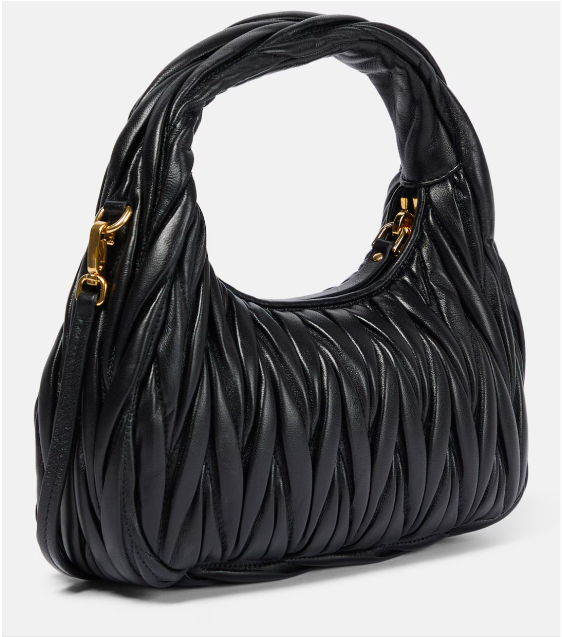 Black quilted handbag with gold hardware on a white background