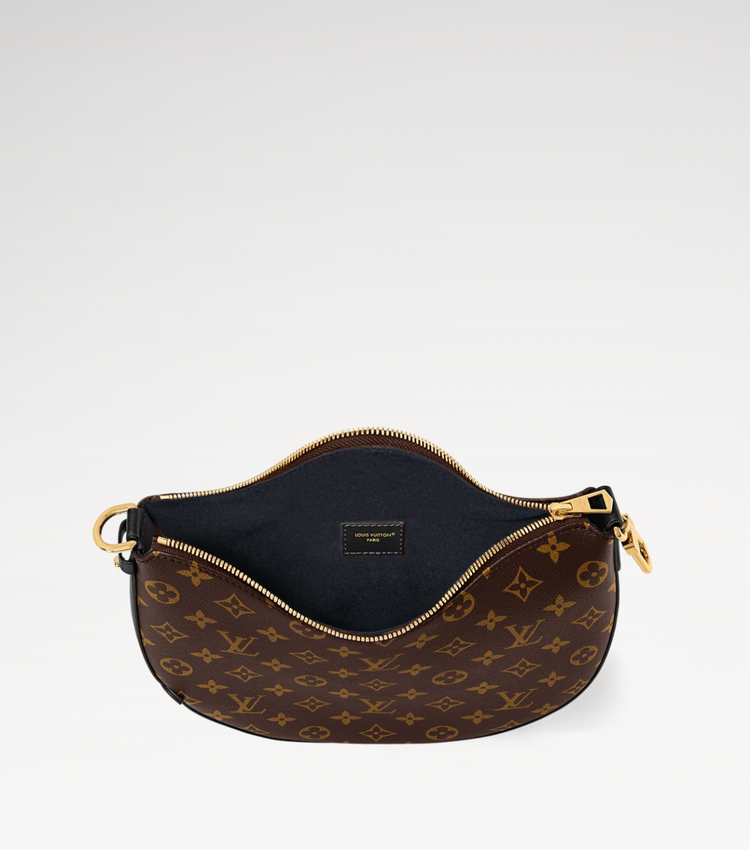 Louis Vuitton handbag with monogram pattern on a white background