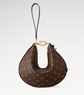 Designer handbag with monogram pattern on a light gray background