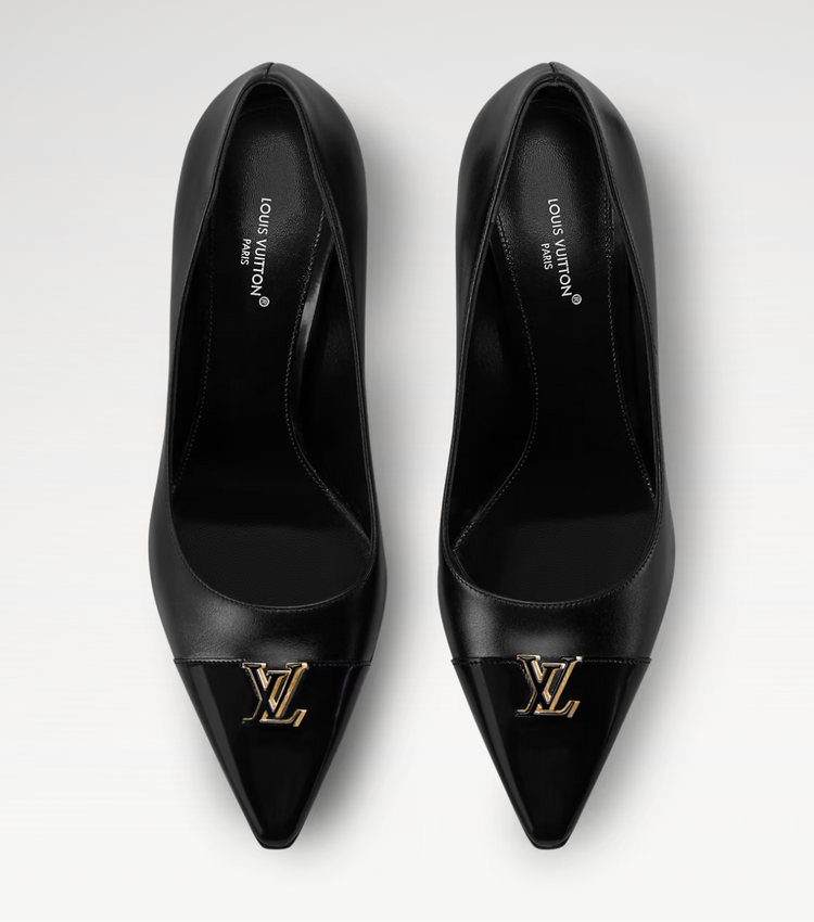 Pair of black high-heeled shoes with gold Louis Vuitton logo on a white background