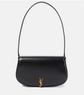 Black handbag with a gold logo on a white background