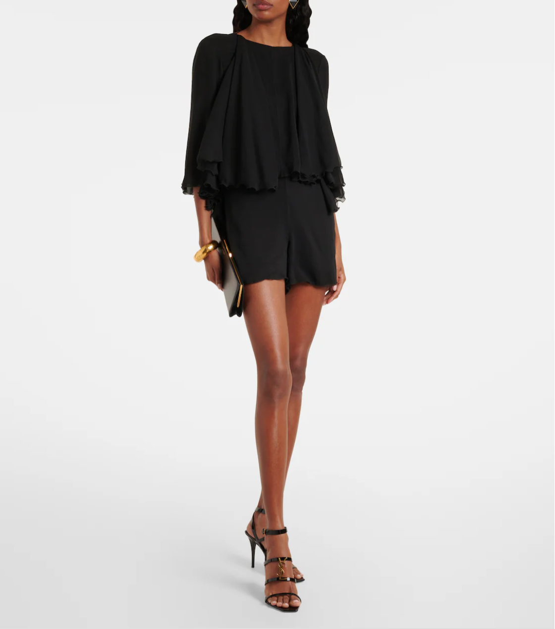 Woman wearing a black outfit with a white background
