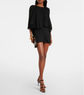 Woman wearing a black outfit with a white background