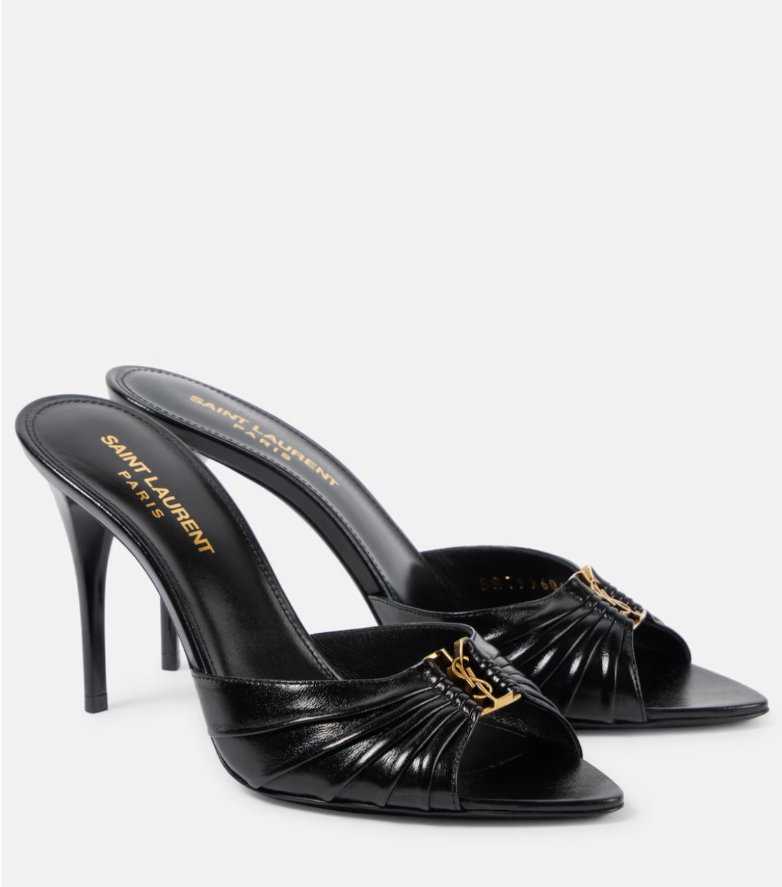 Black high-heeled sandals with gold accents on a white background