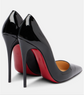Black high-heeled shoes with red soles on a white background