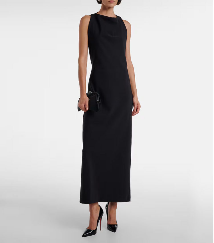 Black sleeveless dress worn by a model on a white background